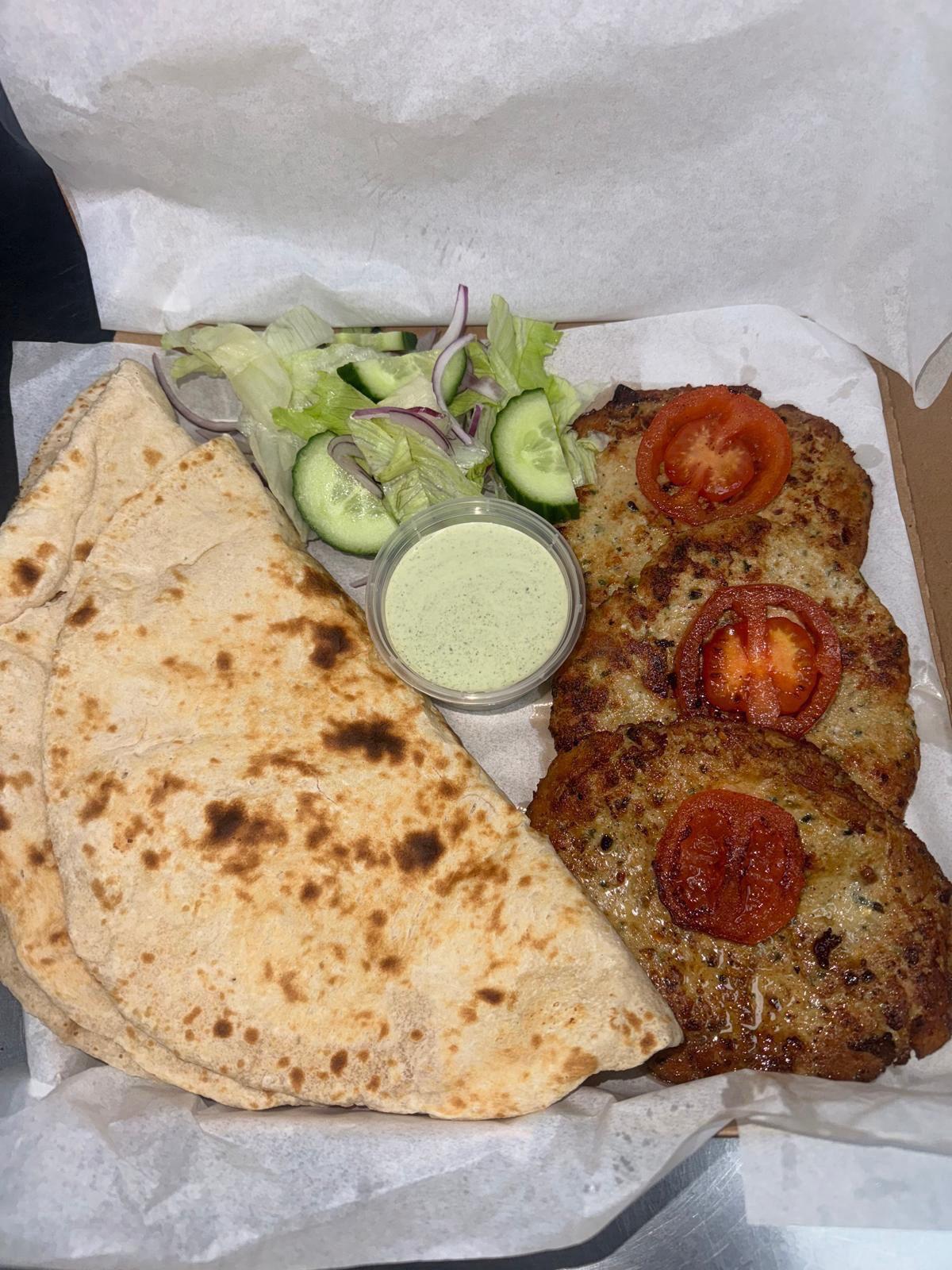 Chapli kebab meal with naan, salad and mint sauce from King Kebabish Pizza