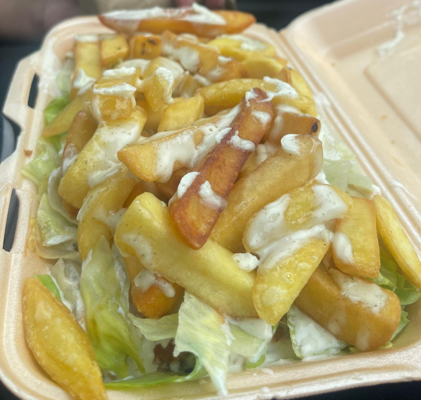 Loaded chips with salad and garlic sauce from King Kebabish